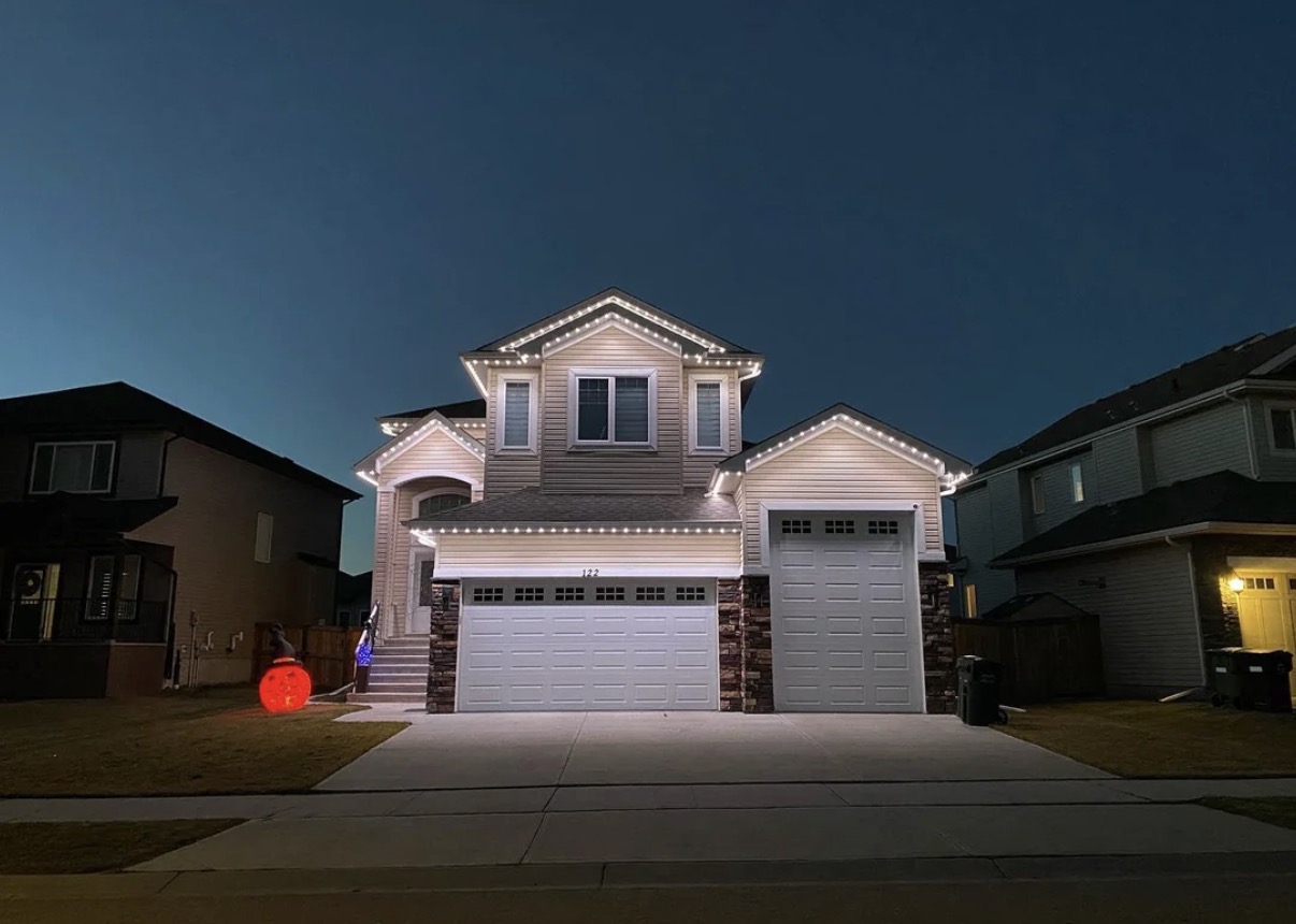 Exterior home lighting at dusk in Aurora