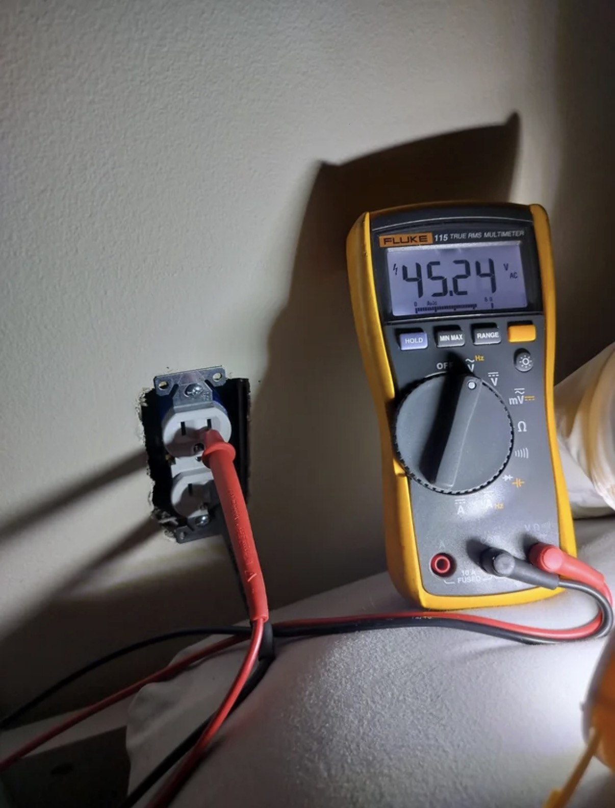 Electrical outlet testing during troubleshooting in Aurora