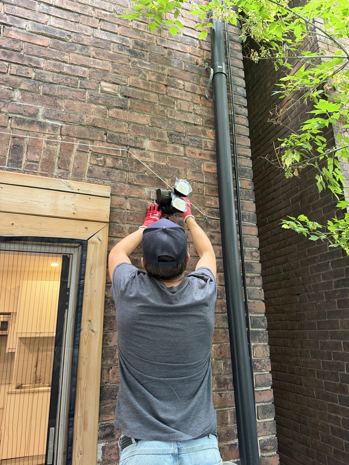 Exterior electrical installation on a brick wall in Aurora